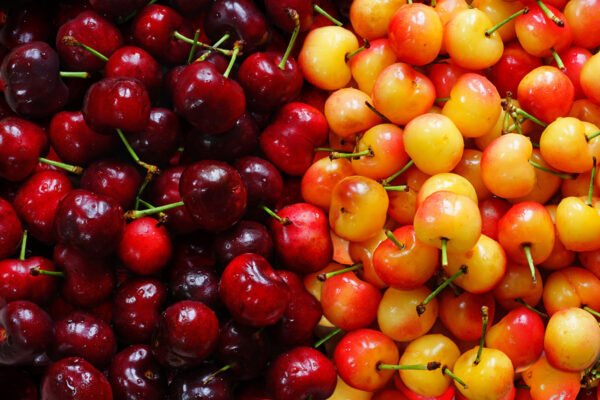 Rainier and Bing cherry half and half image